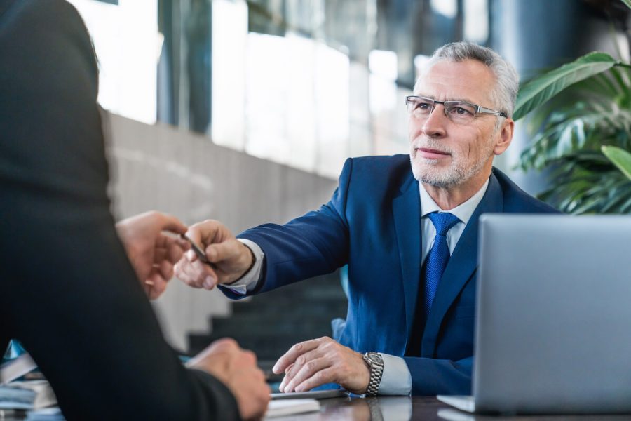 senior-and-young-businessmen-having-a-meeting-in-o-2025-01-09-05-41-56-utc-1.jpg